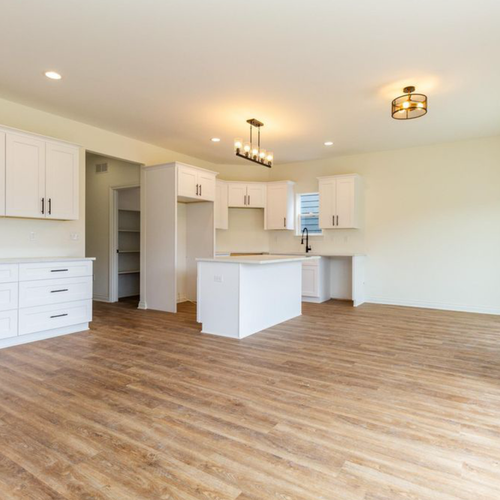 Hardwood floors in a kitchen by Luxx Flooring