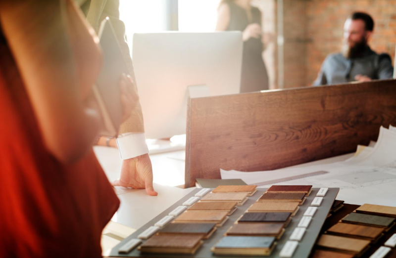 Choosing Flooring Samples in a Flooring Showroom