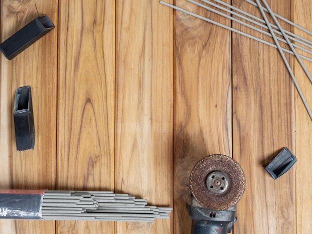 Flooring tools on a hardwood floor surface