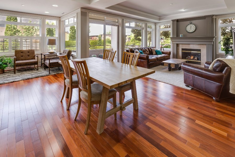 Warm brown hardwood plank flooring in a traditional dining room