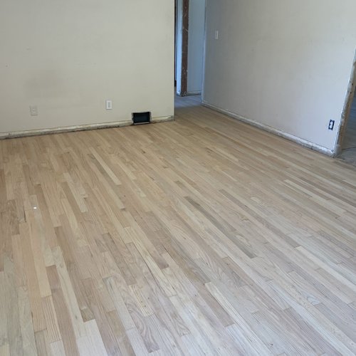 New flooring in an empty room in Macomb, MI