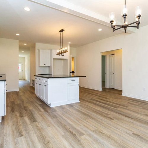 Bright and open kitchen with hardwood flooring