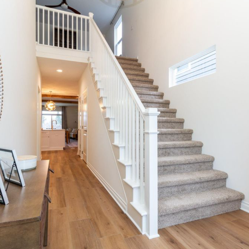 Remodeled hallway with hardwood flooring